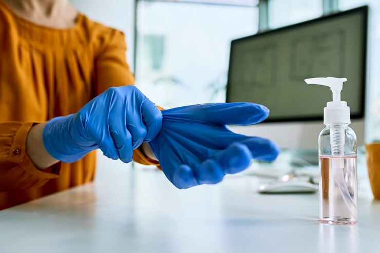 closeup-businesswoman-preparing-work-putting-protective-gloves-office_637285-5439